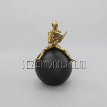 Man with a book on a sphere - resin figure
