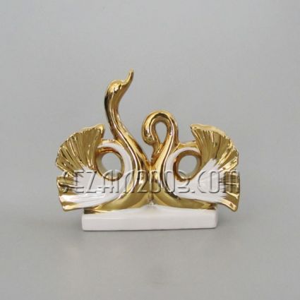Pair of swans – sculpture in white ceramic and gold-plating.